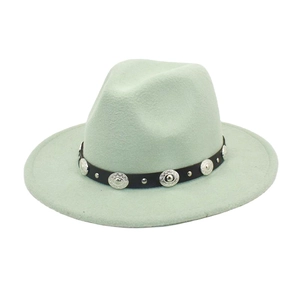 Detail of light green fedora hat with black leather band and embossed silver metal studs