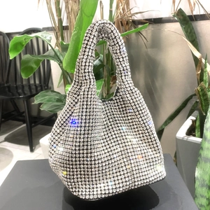 Detailed macro view of silver rhinestone bucket bag with full crystal embellishment