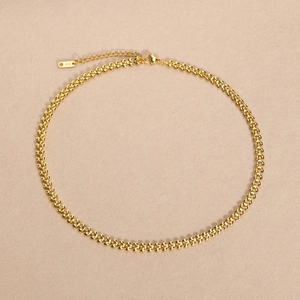 Macro detail of wheat chain necklace with lobster clasp and K18 hallmark engraving