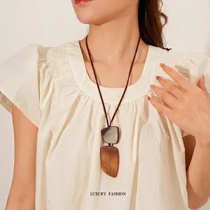 Artistic long necklace with marble resin and wood texture geometric pendants on leather cord
