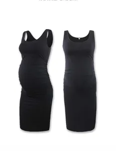 Detail of ruched sides on black sleeveless maternity dress for growing belly
