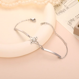Detailed macro of silver stainless steel bracelet with a Celtic knot and infinity design