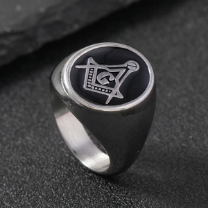 Silver stainless steel ring with black round face featuring a Masonic compass and square