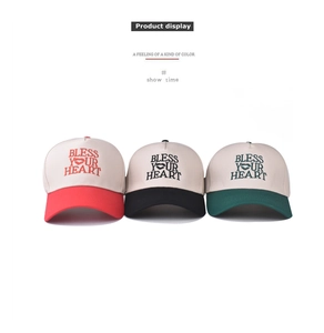 Detailed display of cotton baseball caps with Bless Your Heart embroidery in three colors