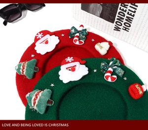Detailed flat lay of red and green wool berets with festive 3D Christmas themed ornaments