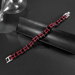 Macro shot of red and black bicycle chain bracelet with stainless steel metal clasps