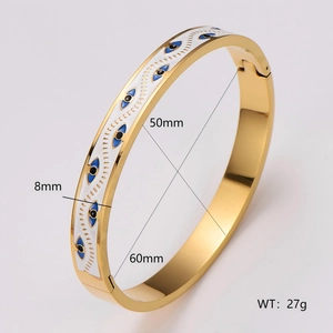 Vintage golden stainless steel open bangle with blue evil eye enamel pattern detail