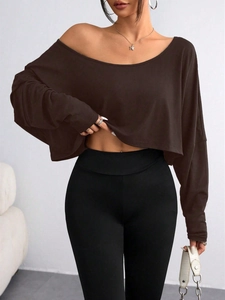 Detail view of the brown off-shoulder long sleeve top with cotton blend fabric texture