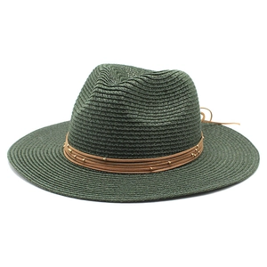 Close-up of dark green straw fedora hat with brown beaded leather band details