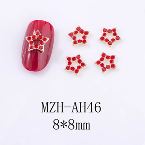 Charm's ongle étoile en strass rouge avec base dorée pour manucures de Noël festives