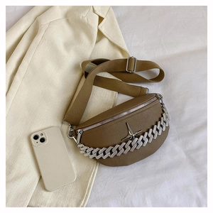 Brown moon-shaped chest bag with silver chain detail and star emblem on white background