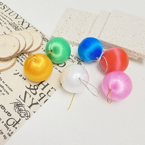 Set of six colorful silk-wrapped Christmas foam balls for holiday tree decorations