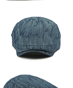 Detailed view of dark blue jacquard cotton denim beret with vintage woven texture