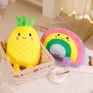 Plush yellow pineapple and colorful rainbow stuffed pillows on a white woven basket