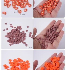 Detail view of colorful DIY polymer clay slices in orange and floral shapes for crafts
