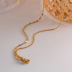 French style double-layered tassel necklace in gold with mixed bead and twist chain