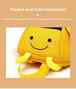 Detail of yellow toddler bee backpack featuring cute cartoon face and 3D antennas
