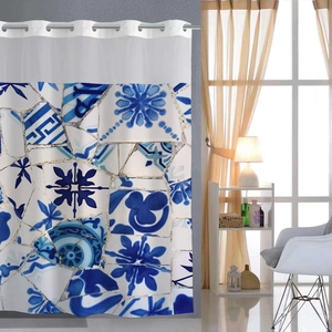 Detail of blue mosaic waffle weave shower curtain with silver metal grommets at top
