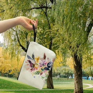 Pochette trucchi in tela floreale con fiori viola e gialli e cinturino da polso nero