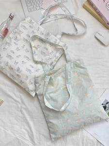 Canvas tote bags with cute cartoon cat prints in white and light green for summer