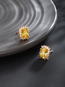 Detail of square emerald-cut yellow gemstone earrings with micro-inlaid halo and gold plating