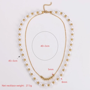 Double-layered gold and white pearl necklace with adjustable length and elegant design