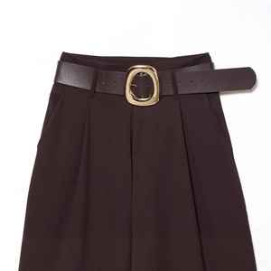 Deep brown high-waisted wide-leg trousers for women with a gold buckle belt