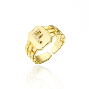 Macro shot of 18K gold plated letter F ring featuring AAA zircon pave and open band