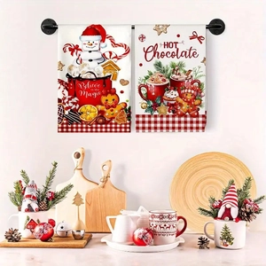 Christmas kitchen towels with snowman and hot chocolate patterns hanging in a cozy kitchen