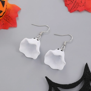 Detail of white ghost earrings for Halloween with pumpkin and maple leaf decorations