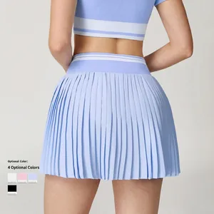 Light blue high waisted pleated tennis skirt with contrast stripes shown from back view