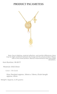Detailed close-up of 925 silver sun pendant with pearls and cross charms in gold finish
