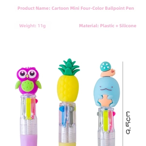 Macro view of cartoon mini 4-color ballpoint pens with silicone toppers and 9.5cm length