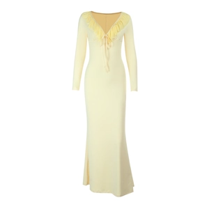 Detail view of the V-neckline with ruffles and tie string on a yellow maxi dress