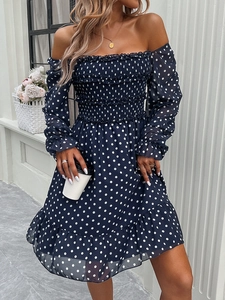Deep blue polka dot off-shoulder dress with smocked bodice and ruffled hemline details