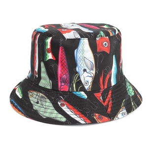 Detailed close-up of fishbone print and reinforced stitching on the black bucket hat