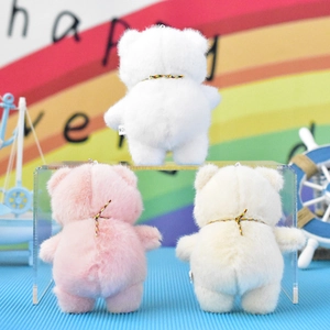 Back view of three cute plush bear keychains in pink, white, and cream colors