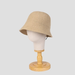 Detail showing the intricate knitted texture of a beige summer sun hat for women