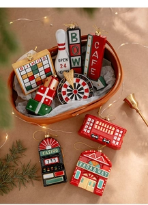 Detailed close-up of vintage Christmas tree ornaments with glossy resin finish and gold strings