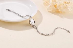 Detailed close-up of a silver elephant pendant bracelet with adjustable extension chain
