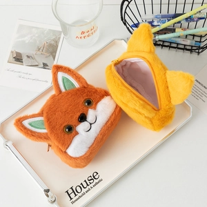 Detail showing plush fox coin purse with soft faux rabbit fur and smooth zipper closure