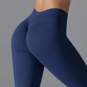 Detail of high-waisted seamless navy blue yoga pants with scrunch butt lifting effect