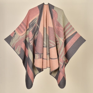 Close-up detail of knitted ginkgo leaf pattern shawl in pink, beige and gray tones