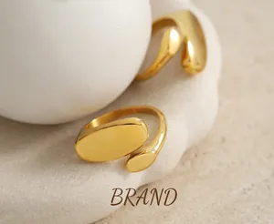 Macro detail of high-polish double oval 18k gold plated stainless steel open ring