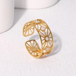 Golden sunburst cutout open ring with white pearl accents in Bohemian style