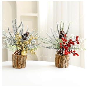 Mini artificial Christmas trees with red and gold berries on rustic wooden bases