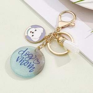 Colorful resin 'Dog Mom' keychain with white tassel and heart pattern gold ring