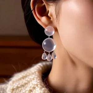 Minimalist resin drop earrings featuring dual translucent beads and teardrop charms