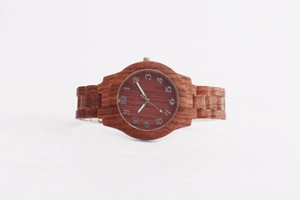 Macro view of red brown wooden watch showcasing natural wood grain and white numerals