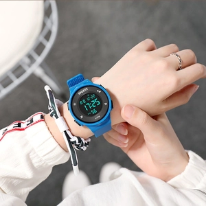 Close-up of blue digital sports watch with 5 ATM water resistance on model's wrist